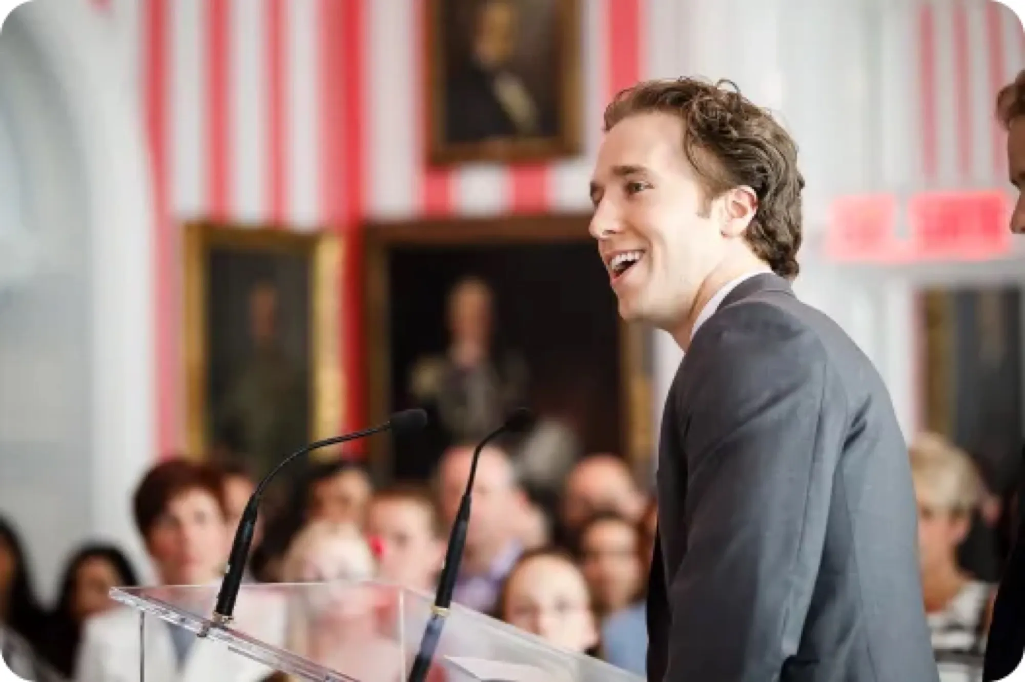 Craig Kielburger speaking at a podium