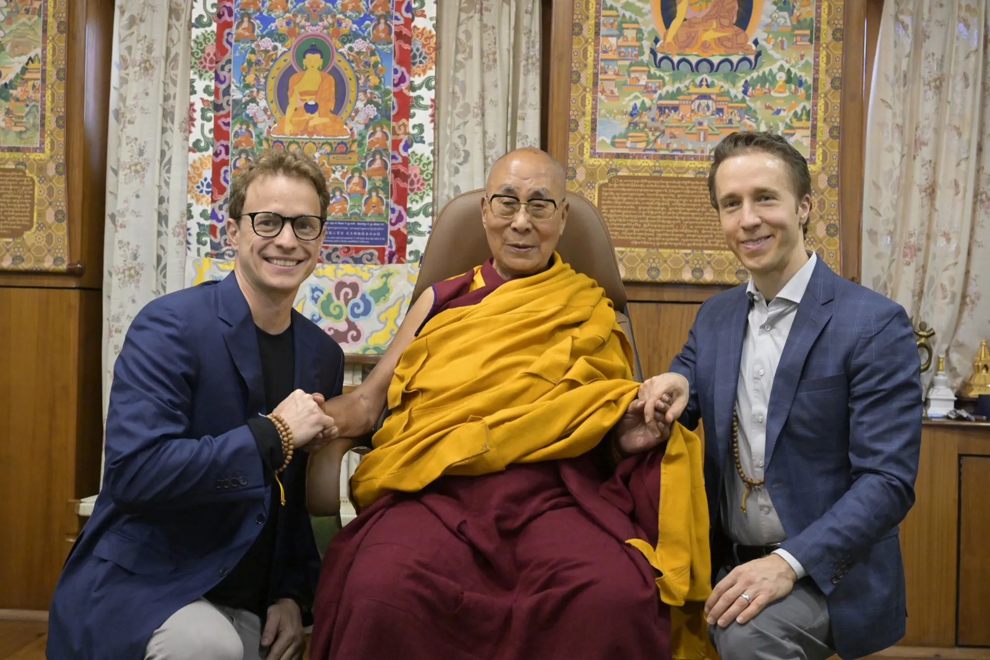 Craig and Marc Kielburger with the Dalai Lama